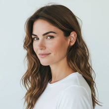 Model wearing 18K gold plated double loop ear cuffs showing elegant minimalist non-pierced hoop earrings style for women