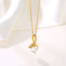 Close-up of 7mm round cubic zirconia stone on 18K gold plated pendant - brilliant diamond-like sparkle.
