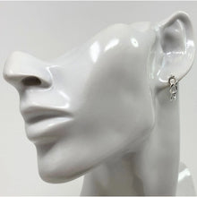 Elegant sterling silver three curb chain stud earrings worn by model, perfect for everyday minimalist style.