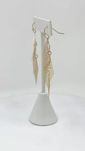 Gold Rhombus Chandelier Earrings with Intricate Filigree: Capture the spotlight with these eye-catching gold rhombus chandelier earrings, featuring dazzling filigree details for a touch of vintage glamour.