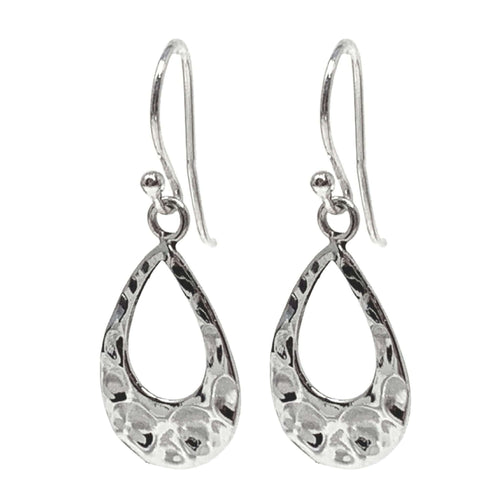 Dainty sterling silver teardrop earrings complement a relaxed, everyday style.