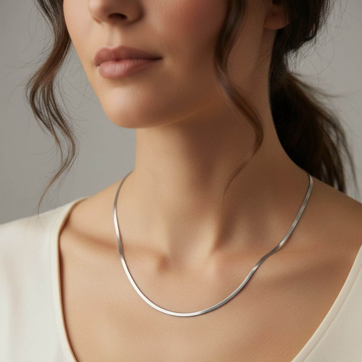 18-inch silver herringbone necklace on model, 3mm flat snake chain in silver stainless steel 