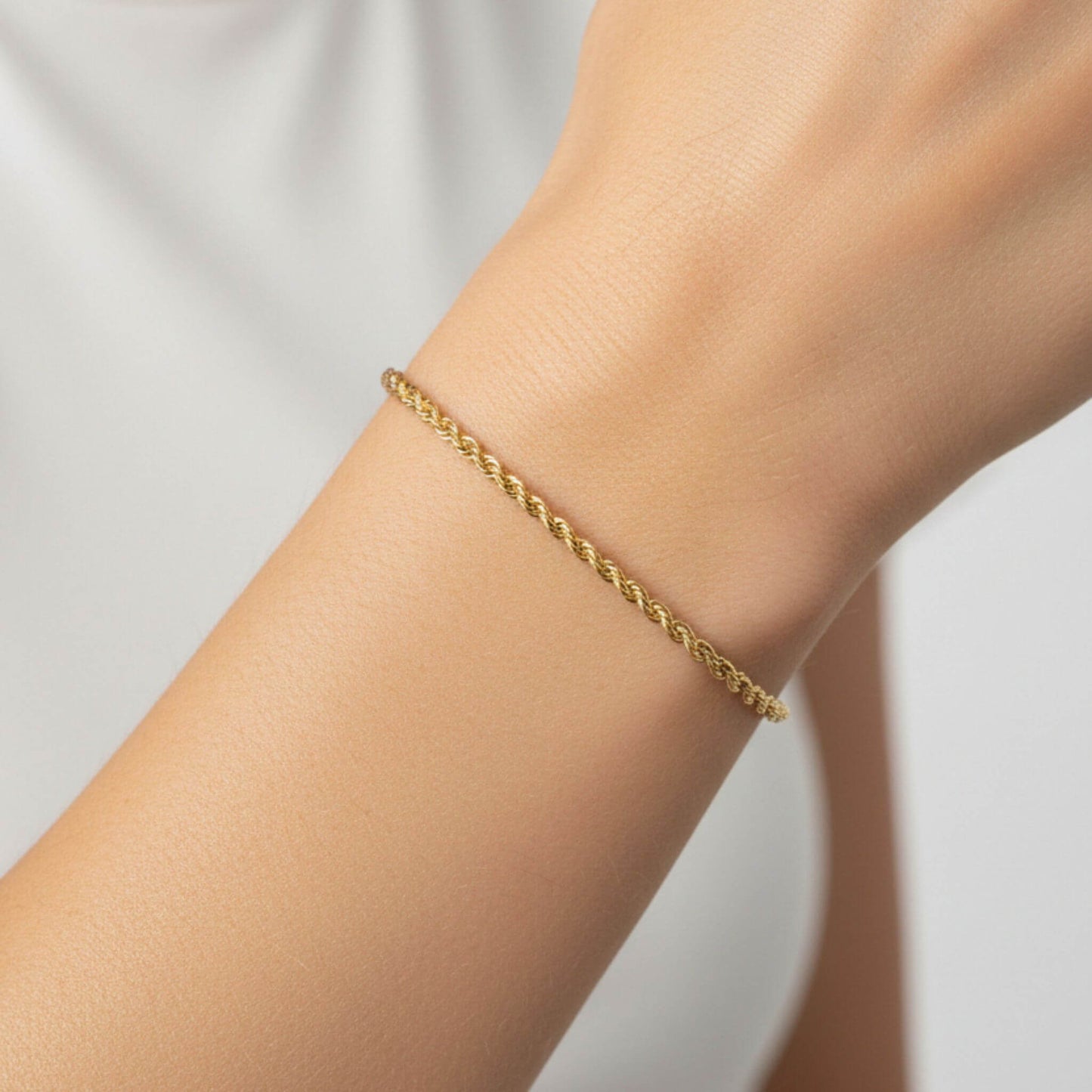 Close-up of 18K gold plated rope chain bracelet showing twisted chain detail