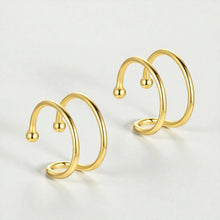 18K gold plated sterling silver double loop ear cuffs displayed on light background showing minimalist non-pierced hoop design for women
