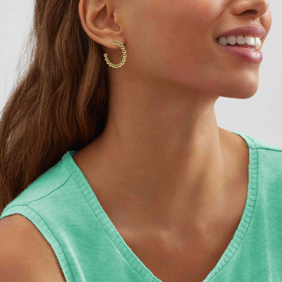 Look and feel your best with statement ball beaded hoops.