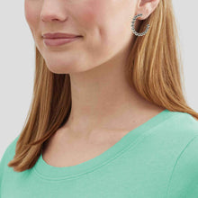 Silver ball beaded hoop earrings elevate any outfit.
