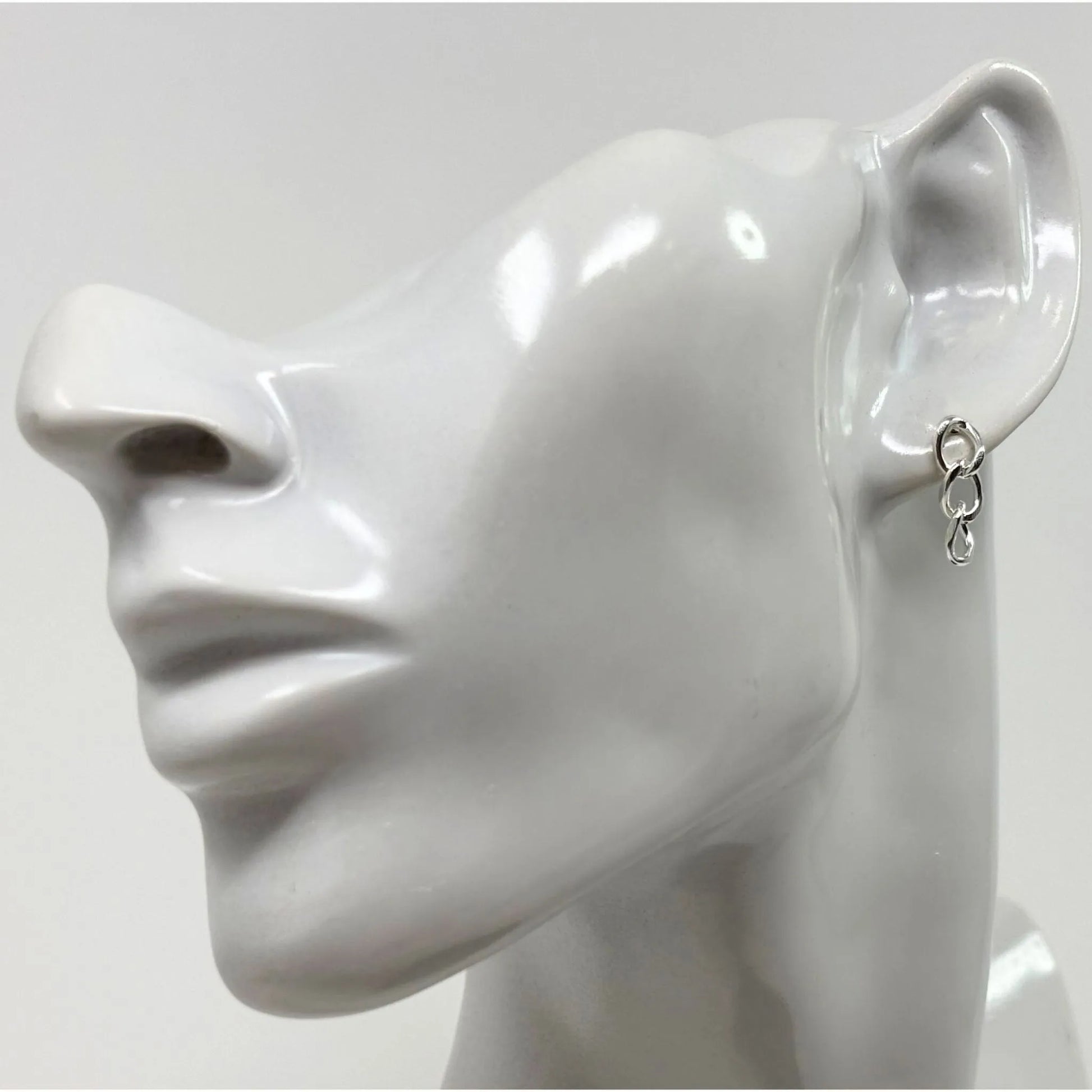 Elegant sterling silver three curb chain stud earrings worn by model, perfect for everyday minimalist style.