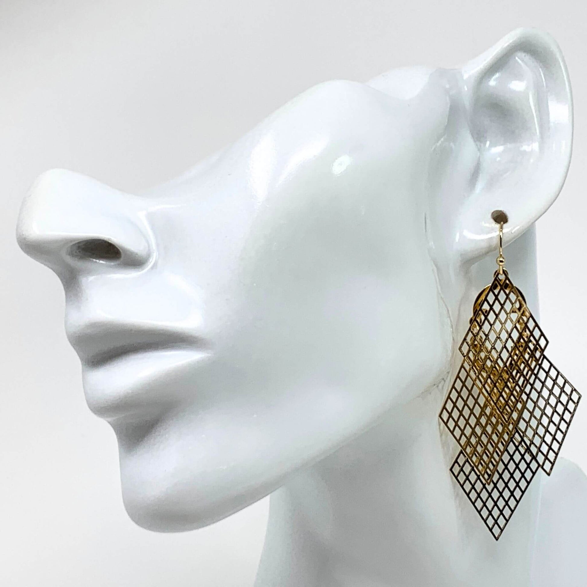 Gold Filigree Chandelier Earrings: Exquisite filigree chandeliers swing gracefully from your ears, making a statement for any occasion.