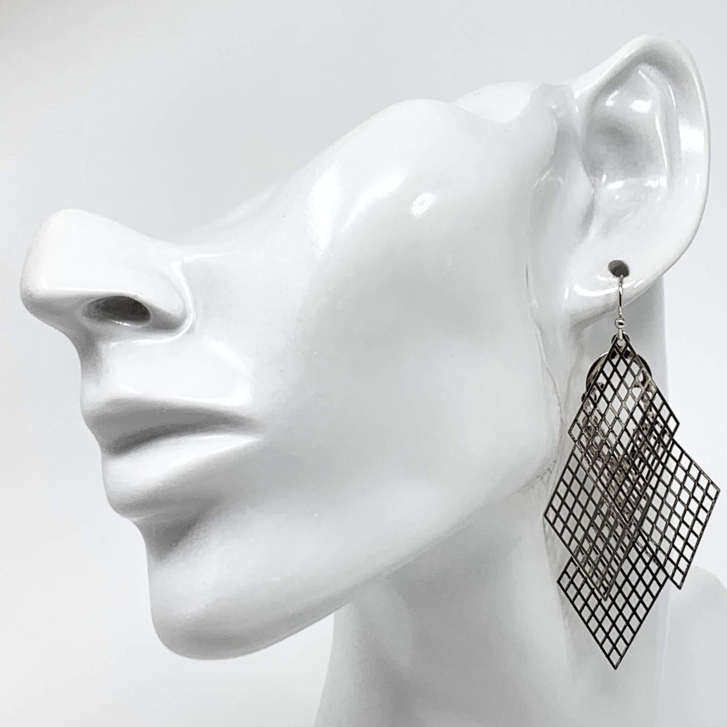 Silver Filigree Chandelier Earrings: Exquisite filigree chandeliers swing gracefully from your ears, making a statement for any occasion.