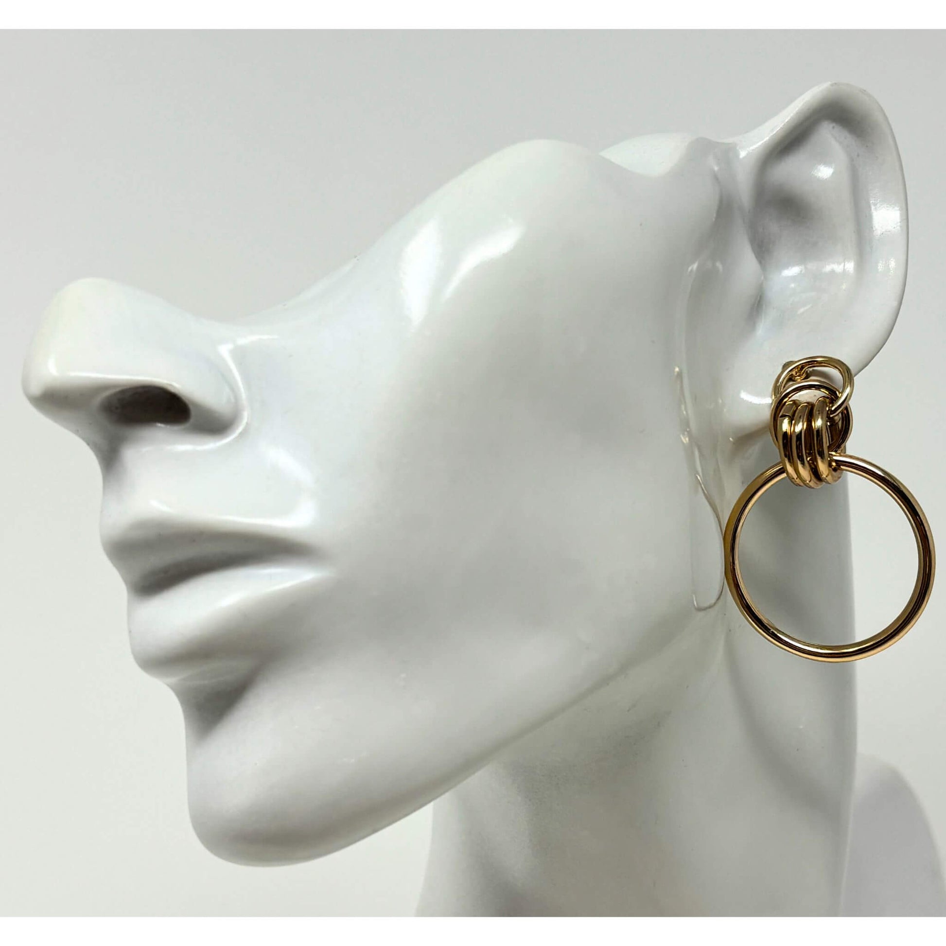 Front view of gold door knocker hoop stud earrings with a modern, elegant design, ideal for everyday fashion wear.