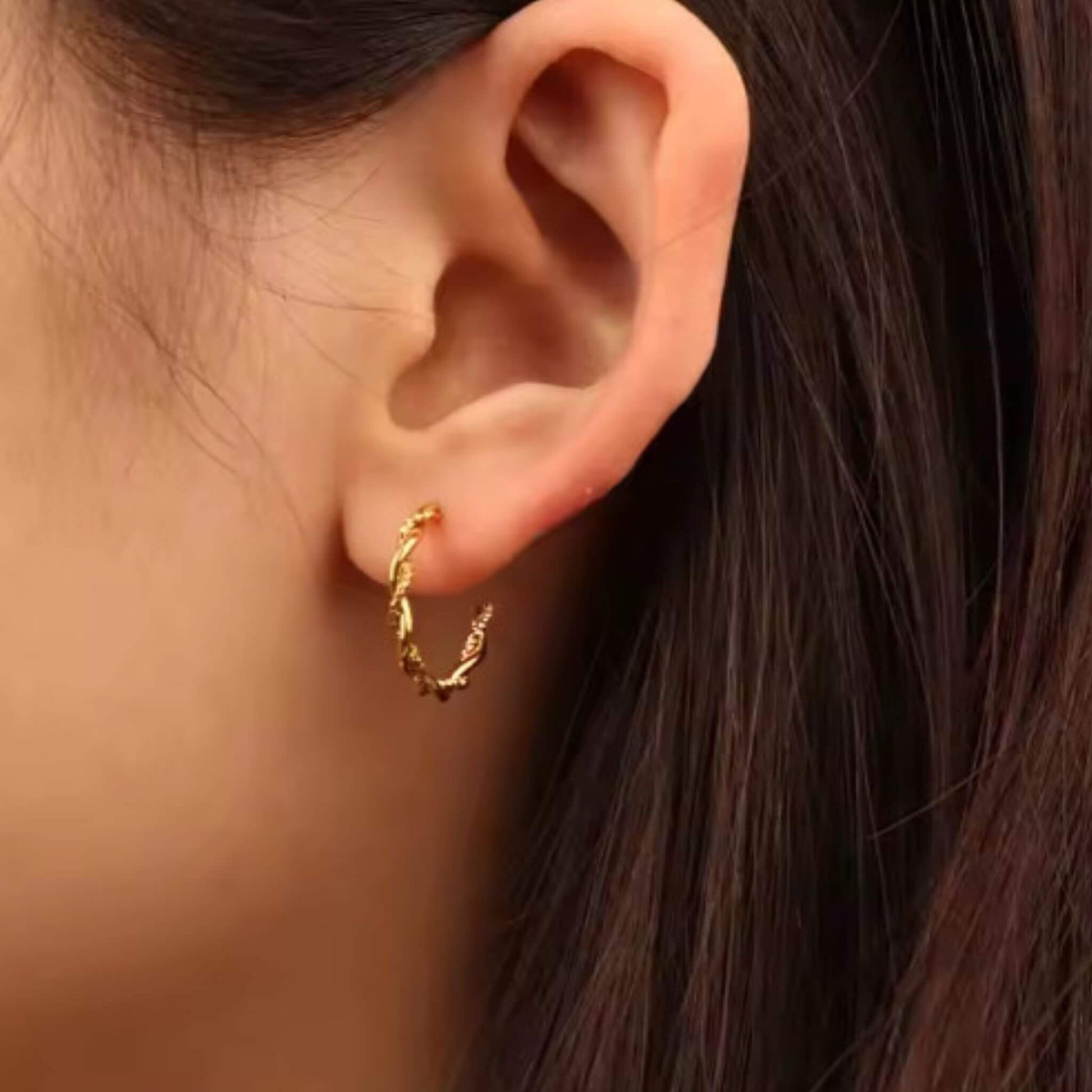 18k gold plated rope twist hoop earrings worn on ear