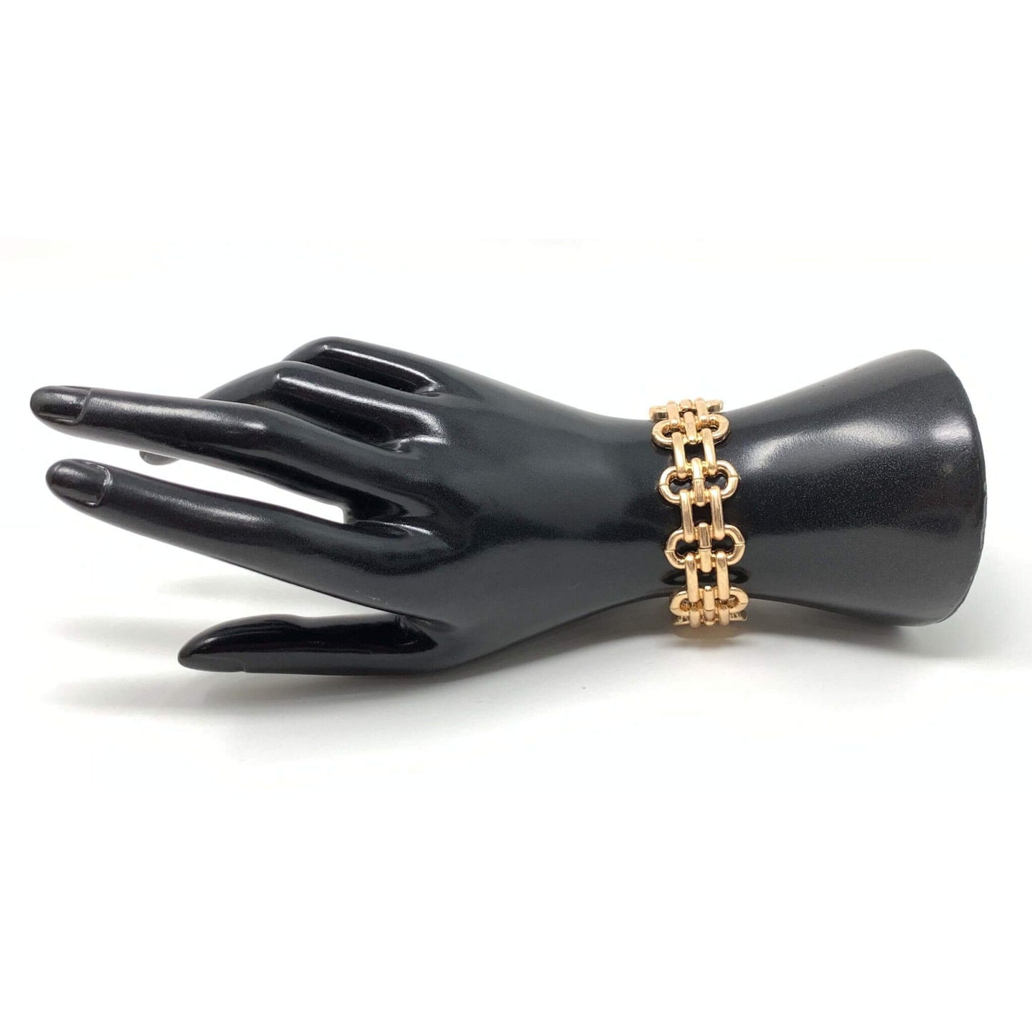 Gold link cuff stretch bracelet that can be stacked with other bracelets.