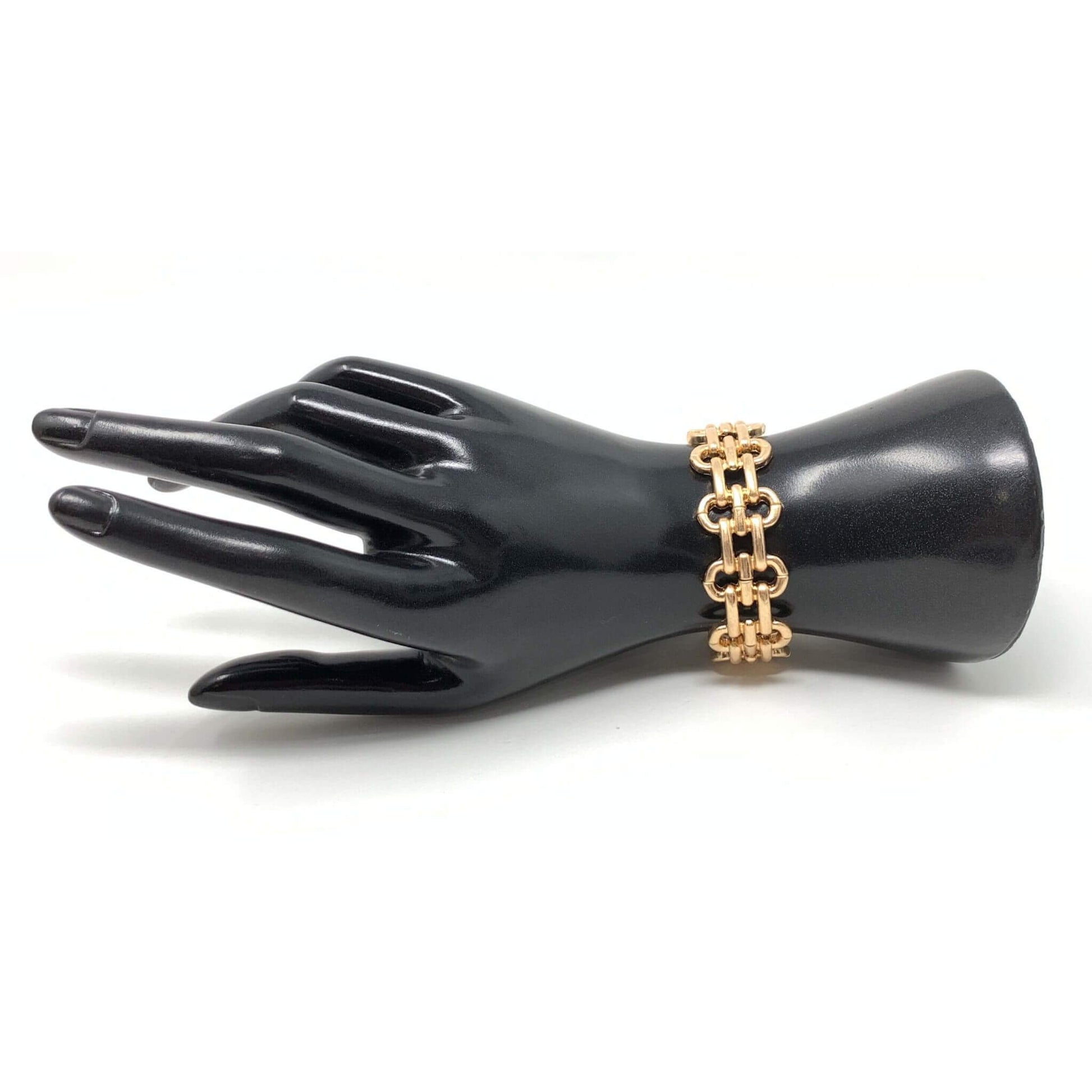 Gold link cuff stretch bracelet that can be stacked with other bracelets.