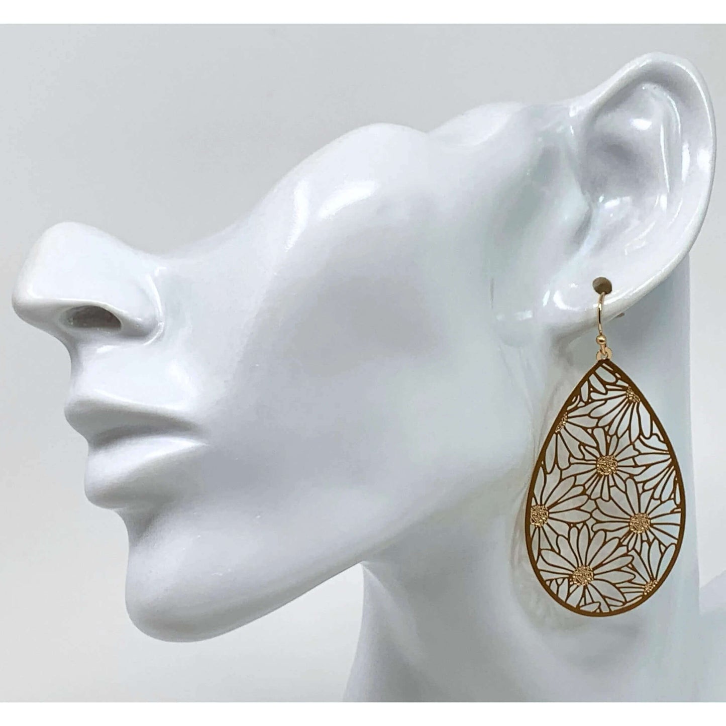 Gold Daisy Teardrop Earrings adding elegance to a formal outfit.
