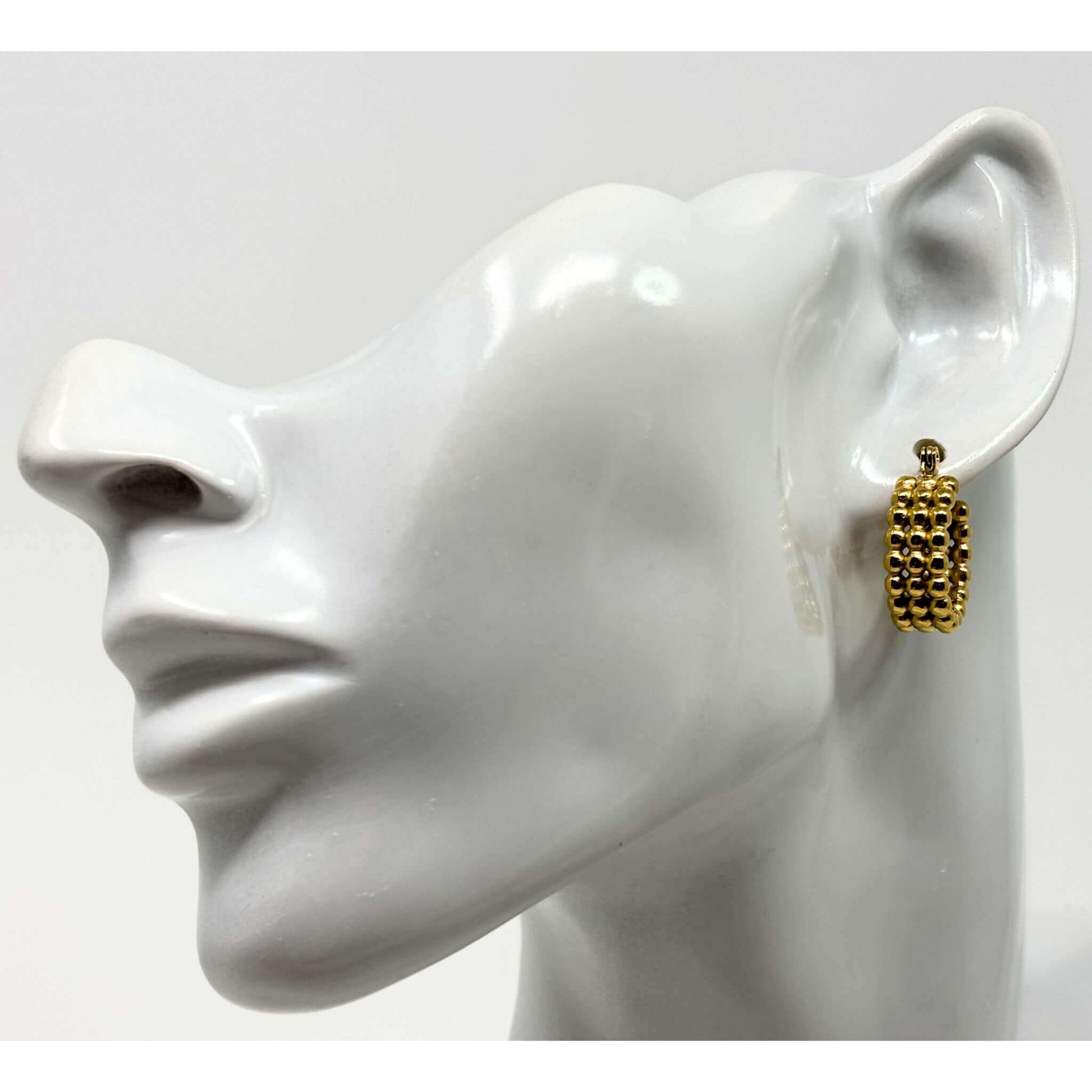 Elegant triple bead gold hoop earrings in 18K gold plating, a must-have accessory for fashionable women.