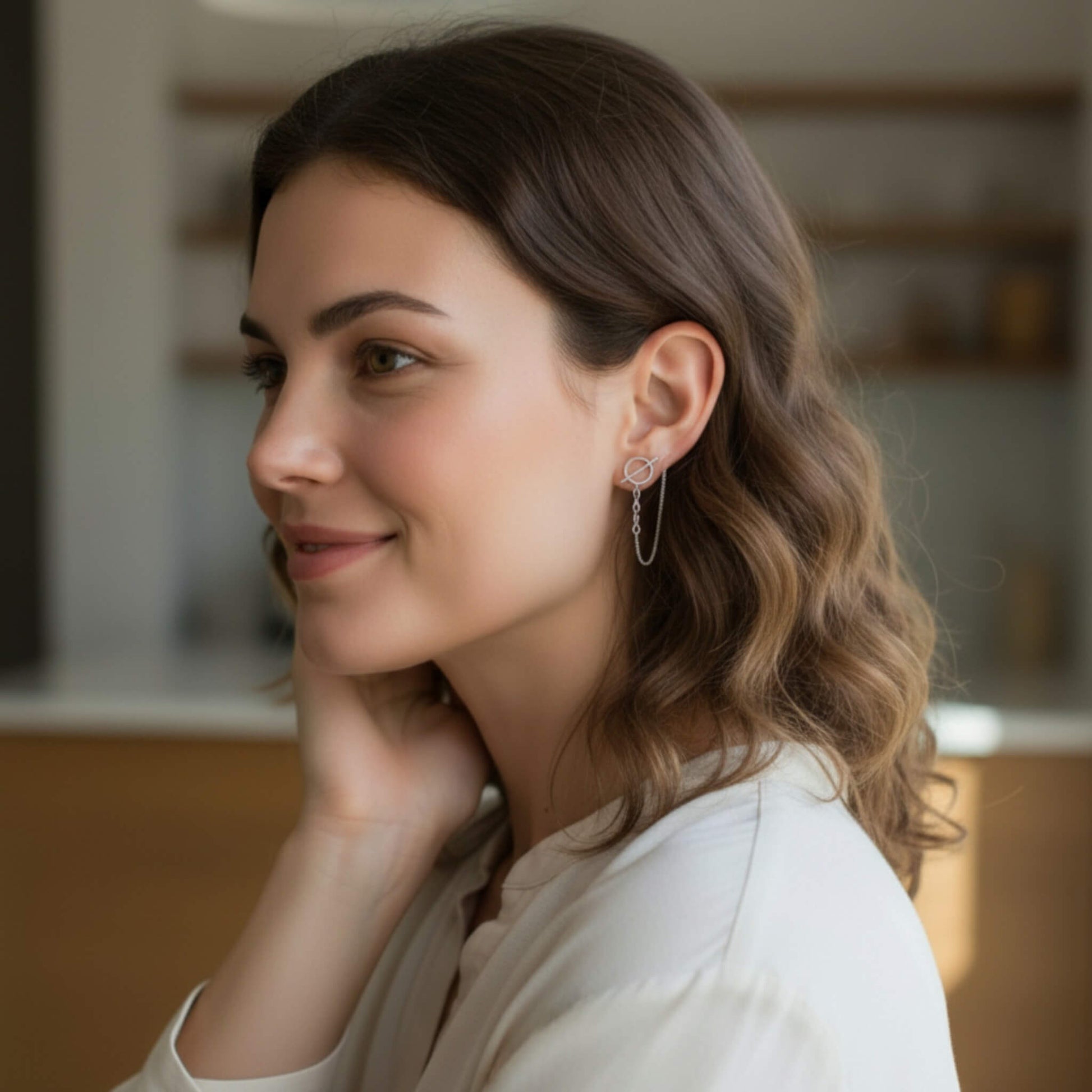 Circle bar chain stud earrings in 925 sterling silver worn by model in natural light