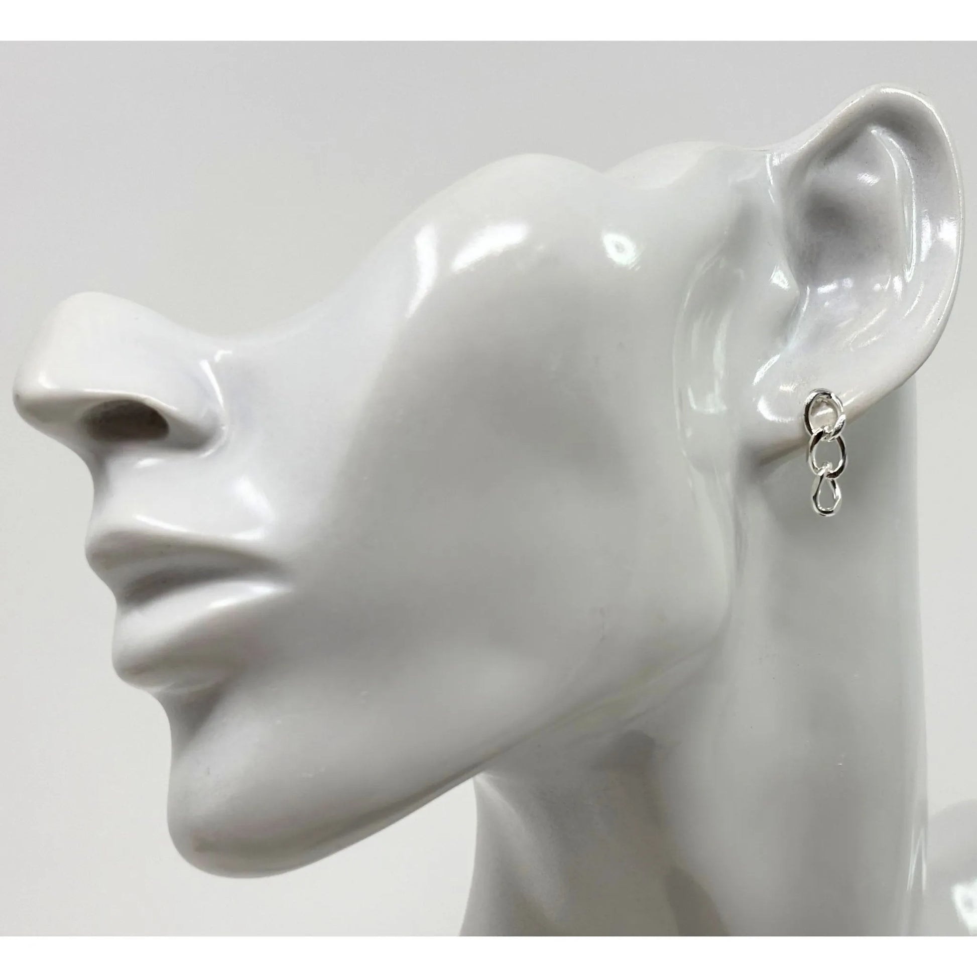 Side profile of minimalist sterling silver three curb chain stud earrings for women