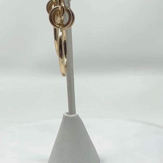 Watch the video showcasing geometric multi-circle gold hoop stud earrings, highlighting their modern and elegant design for fashion jewelry lovers.