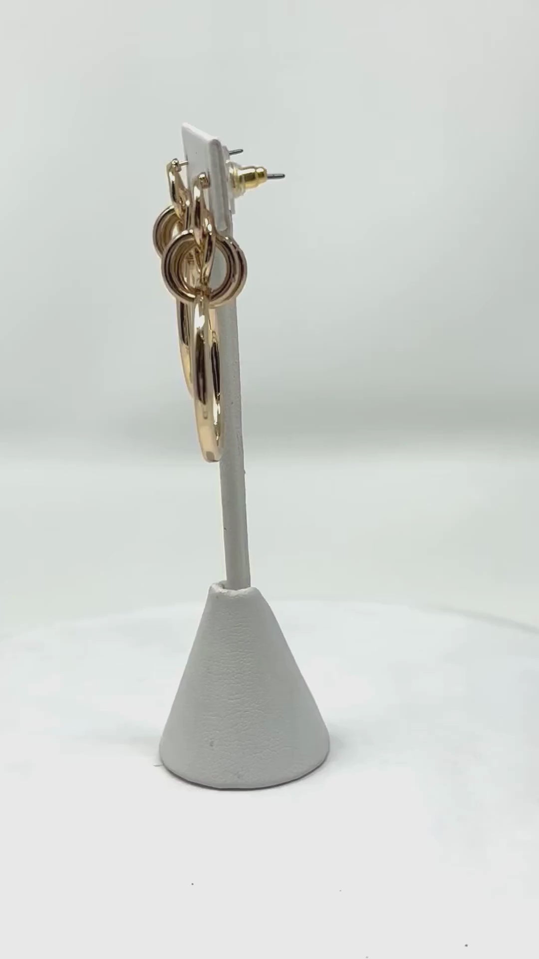 Watch the video showcasing geometric multi-circle gold hoop stud earrings, highlighting their modern and elegant design for fashion jewelry lovers.