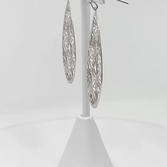 Daisy Teardrop Earrings, suitable for various styles and worn by diverse individuals.