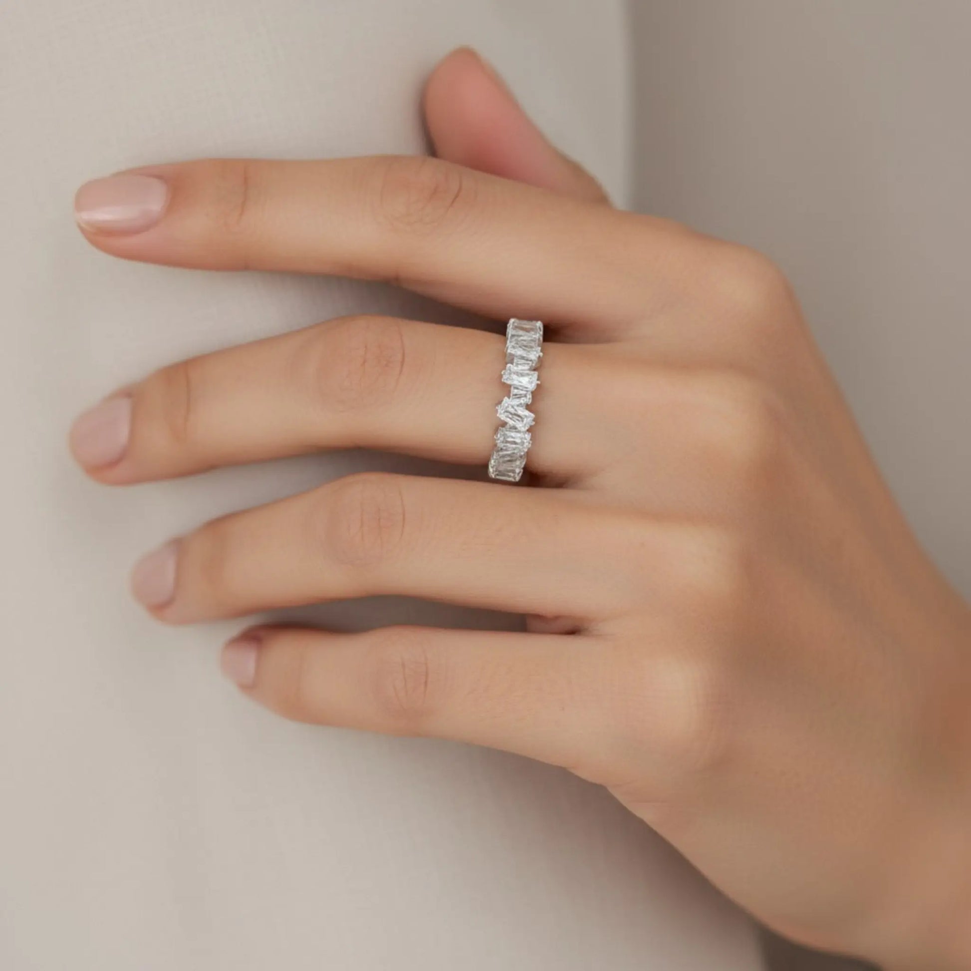 Model wearing silver 5A cubic zirconia open ring on hand showing elegant rectangular stones and adjustable design