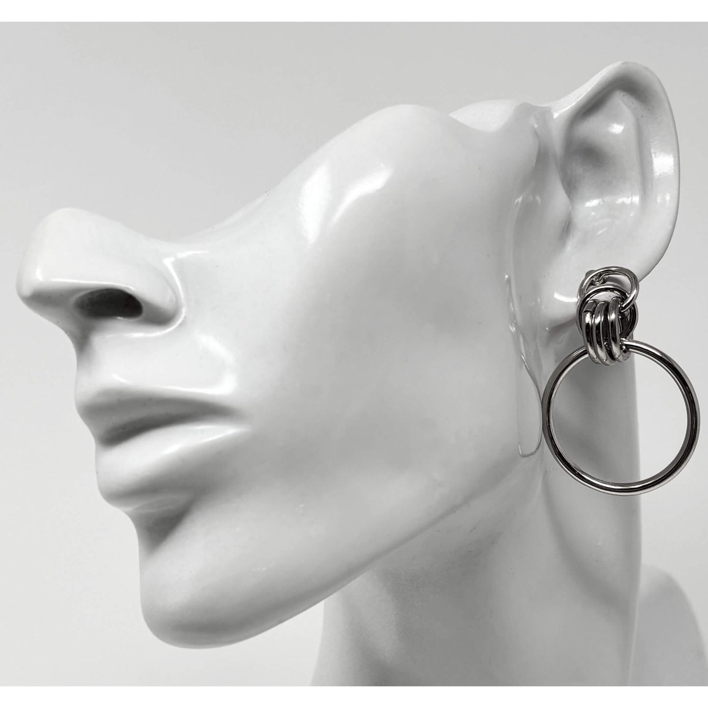 Front view of silver door knocker  hoop stud earrings, showcasing a modern, versatile design suitable for any occasion.