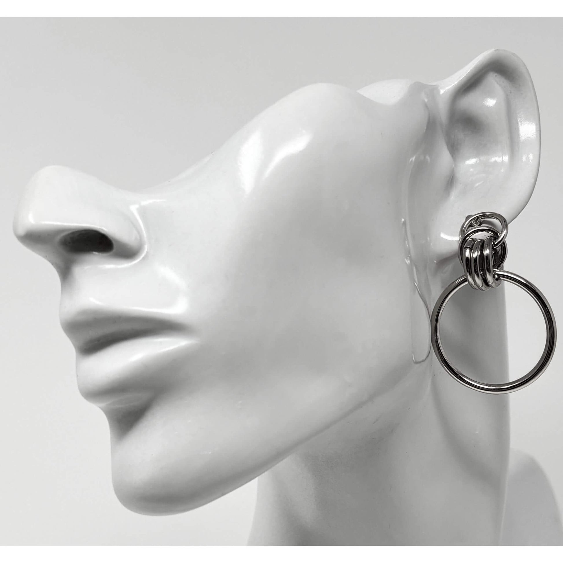 Front view of silver door knocker  hoop stud earrings, showcasing a modern, versatile design suitable for any occasion.