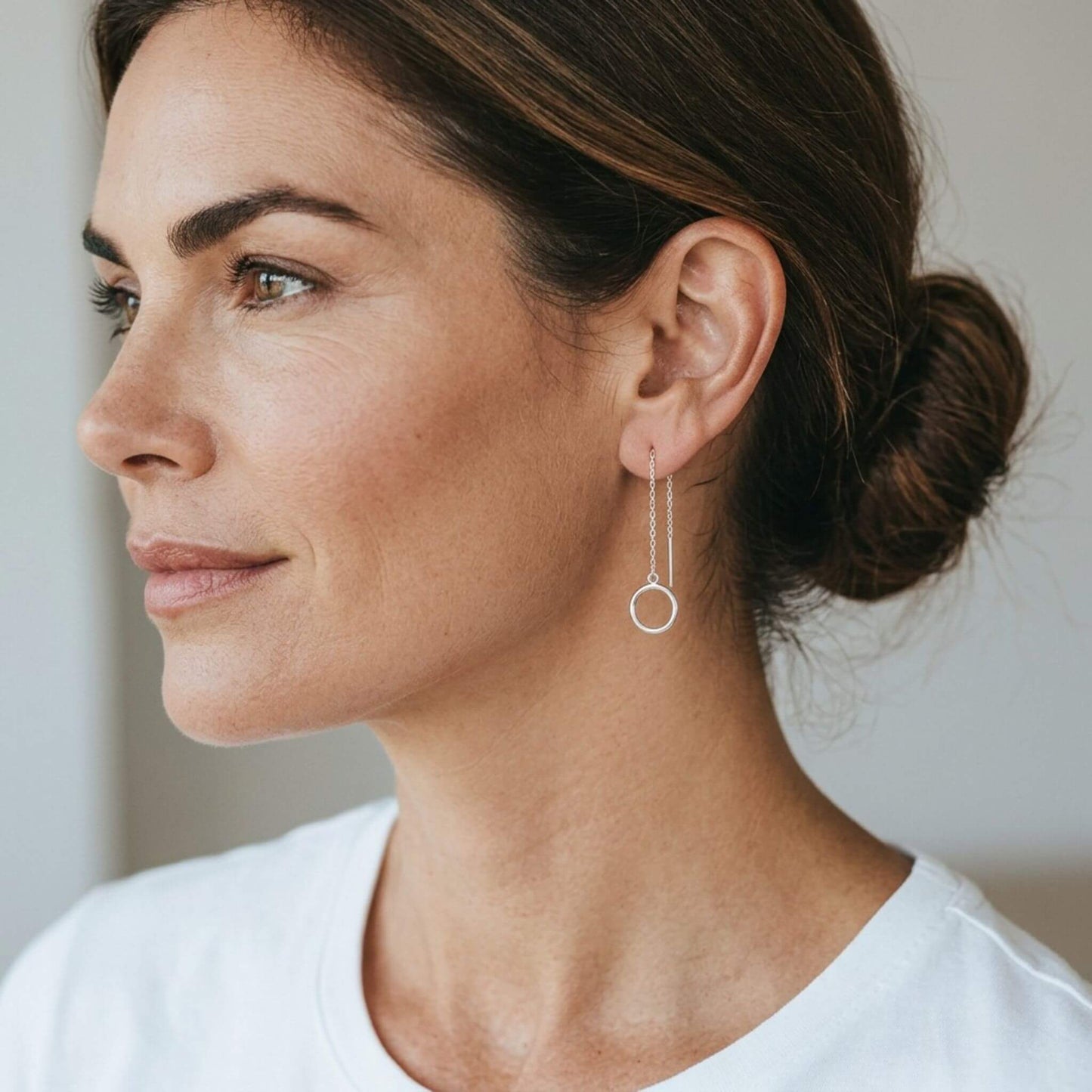 Silver open circle threader earrings styled with updo — delicate silver dangle earrings