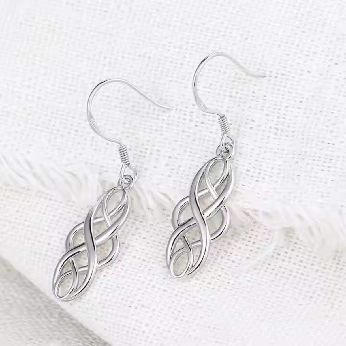 Versatile silver-plated Celtic earrings with timeless motif