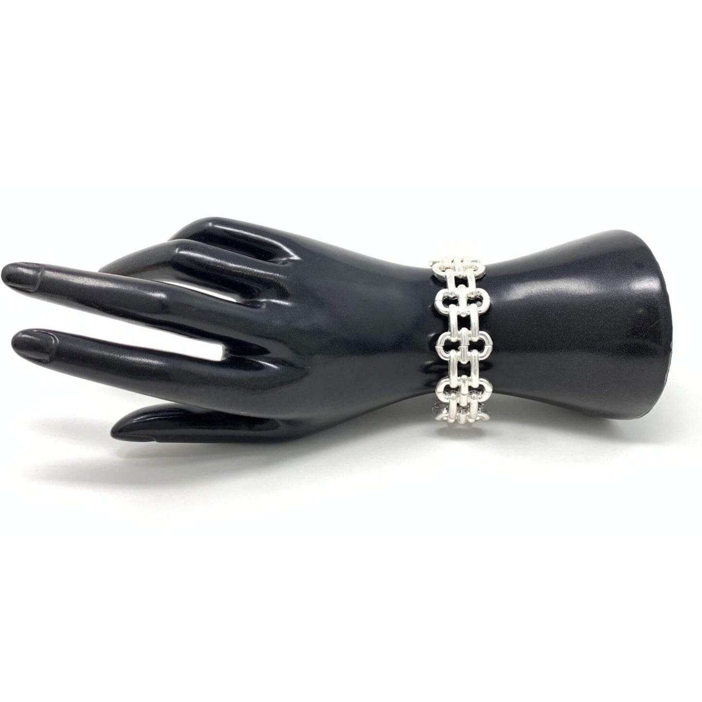 Silver link cuff stretch bracelet that can be stacked with other bracelets.