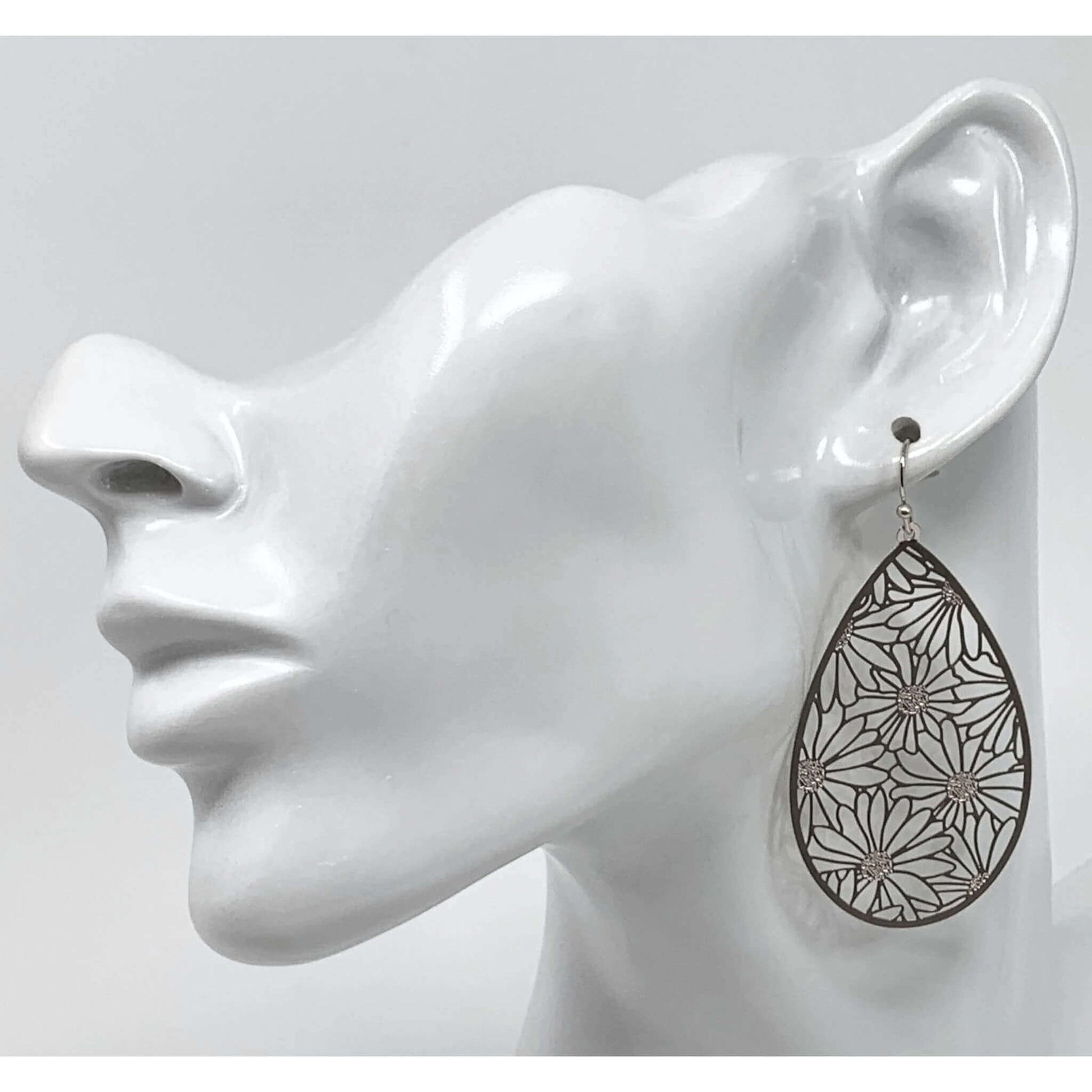Silver Daisy Teardrop Earrings adding elegance to a formal outfit.
