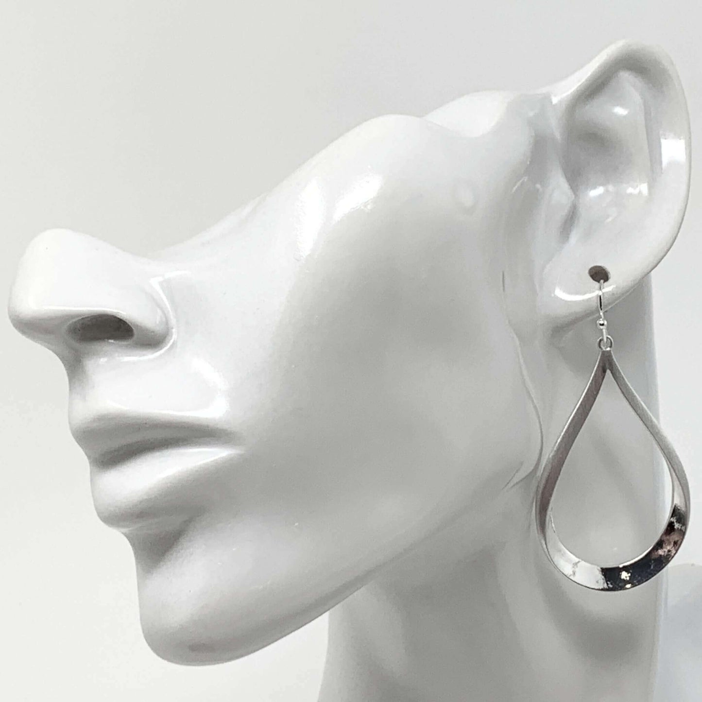 Silver Teardrop Earrings With A Dangling Design