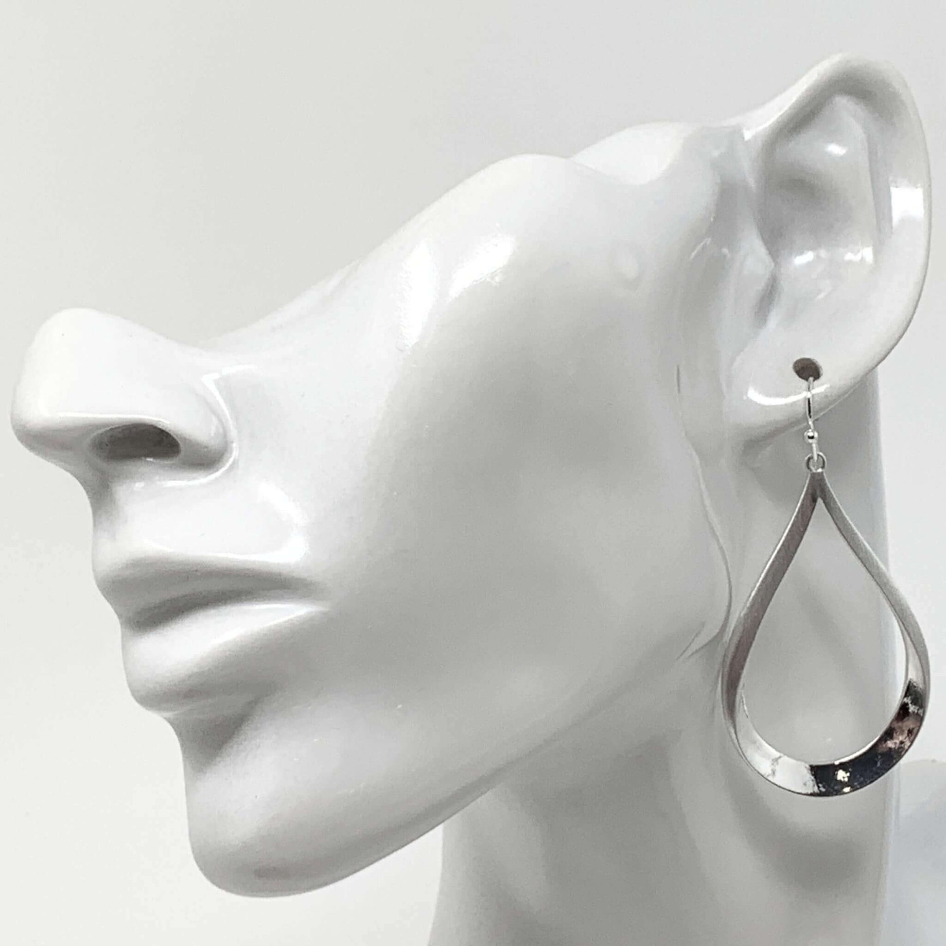 Silver Teardrop Earrings With A Dangling Design
