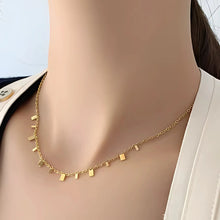 Multi-size rectangle charms necklace in stainless steel and gold finish
