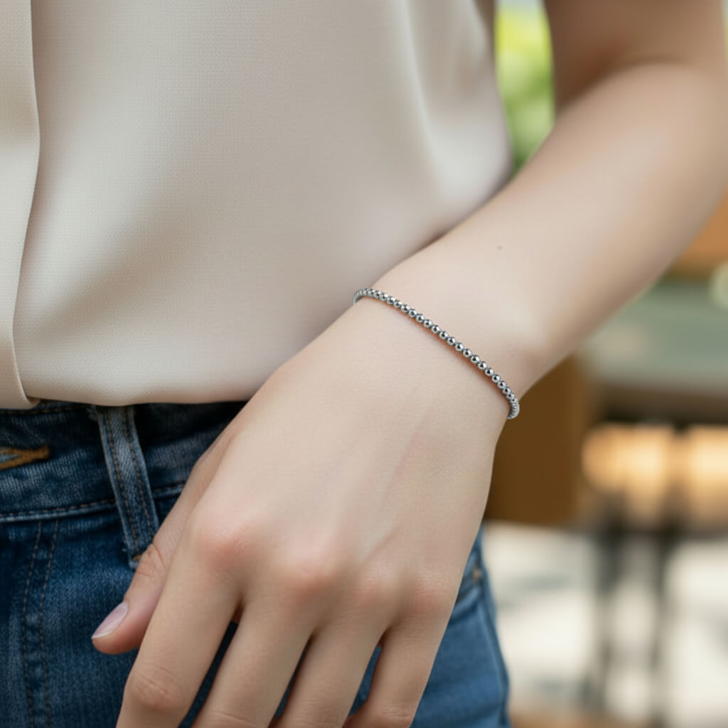 Sterling silver bead bracelet worn on wrist