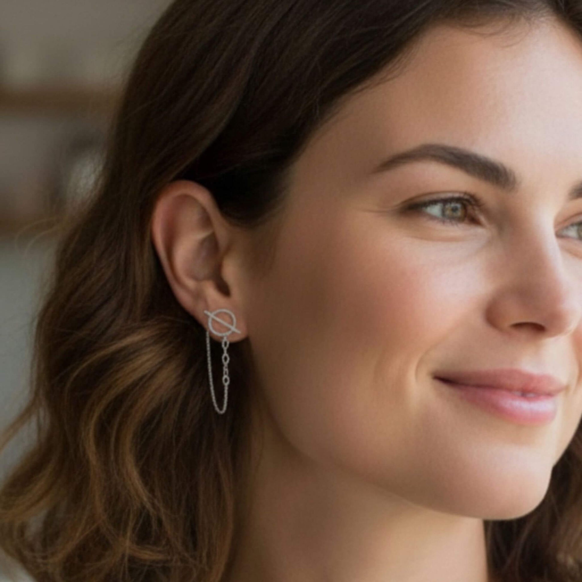 Sterling silver circle bar chain stud earrings worn on ear