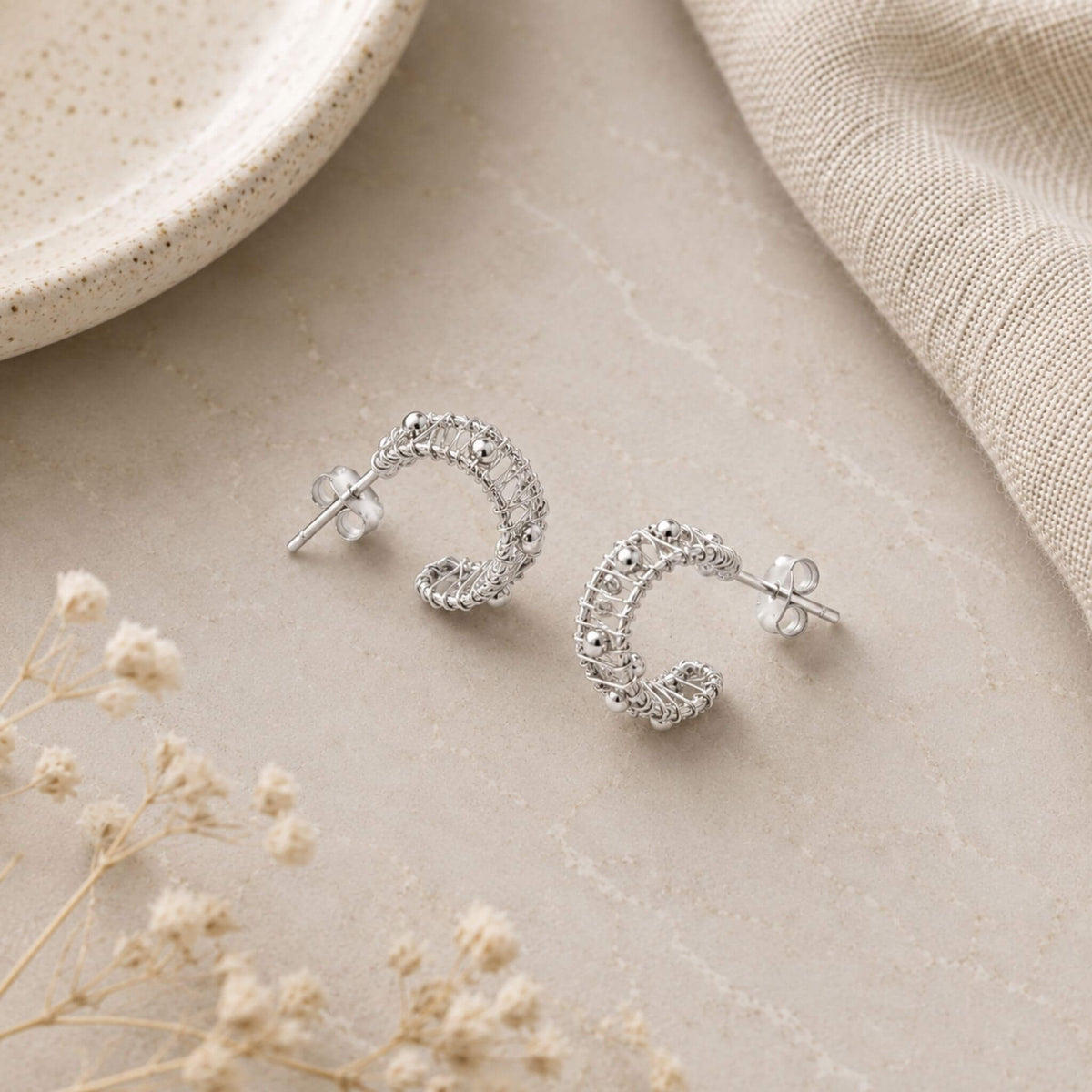 Sterling silver hoop earrings with wire wrapped C-hoop design and polished silver bead accents