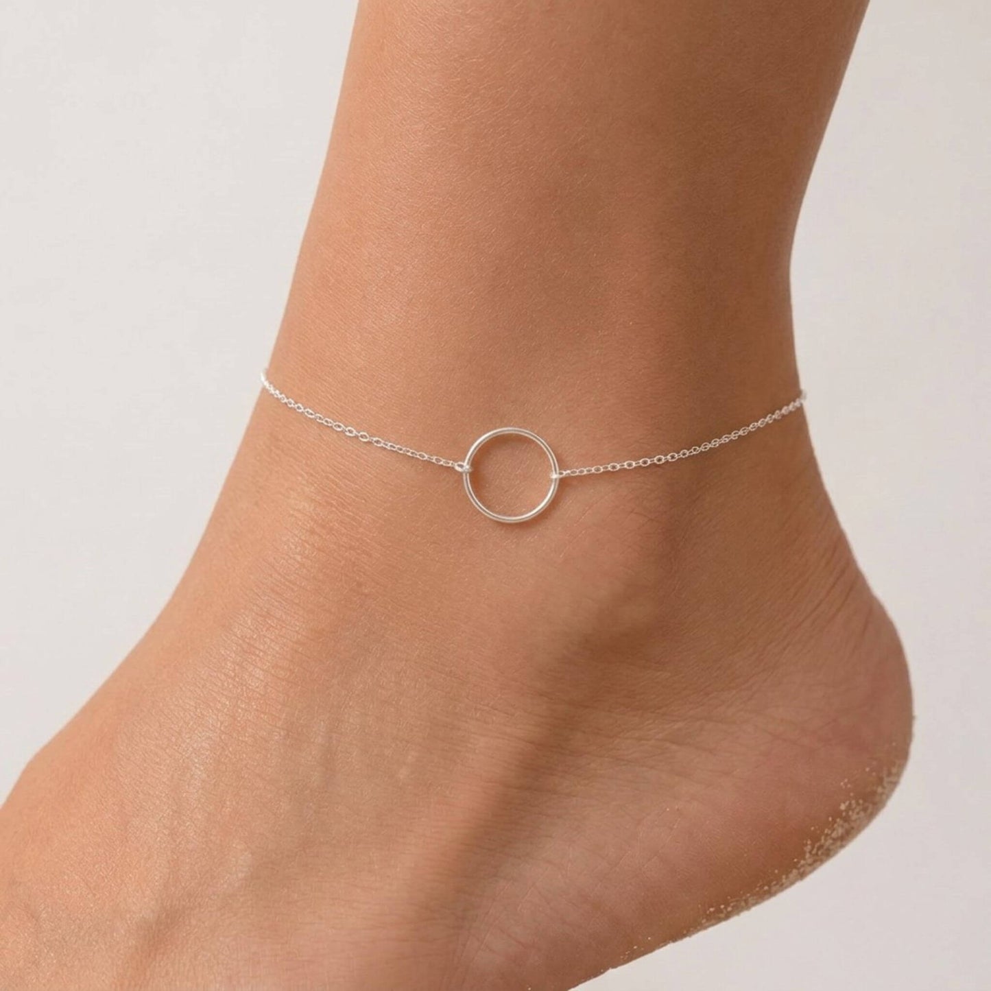 Sterling silver open circle anklet close-up showing 14mm circle charm and cable chain — hypoallergenic ankle bracelet for women