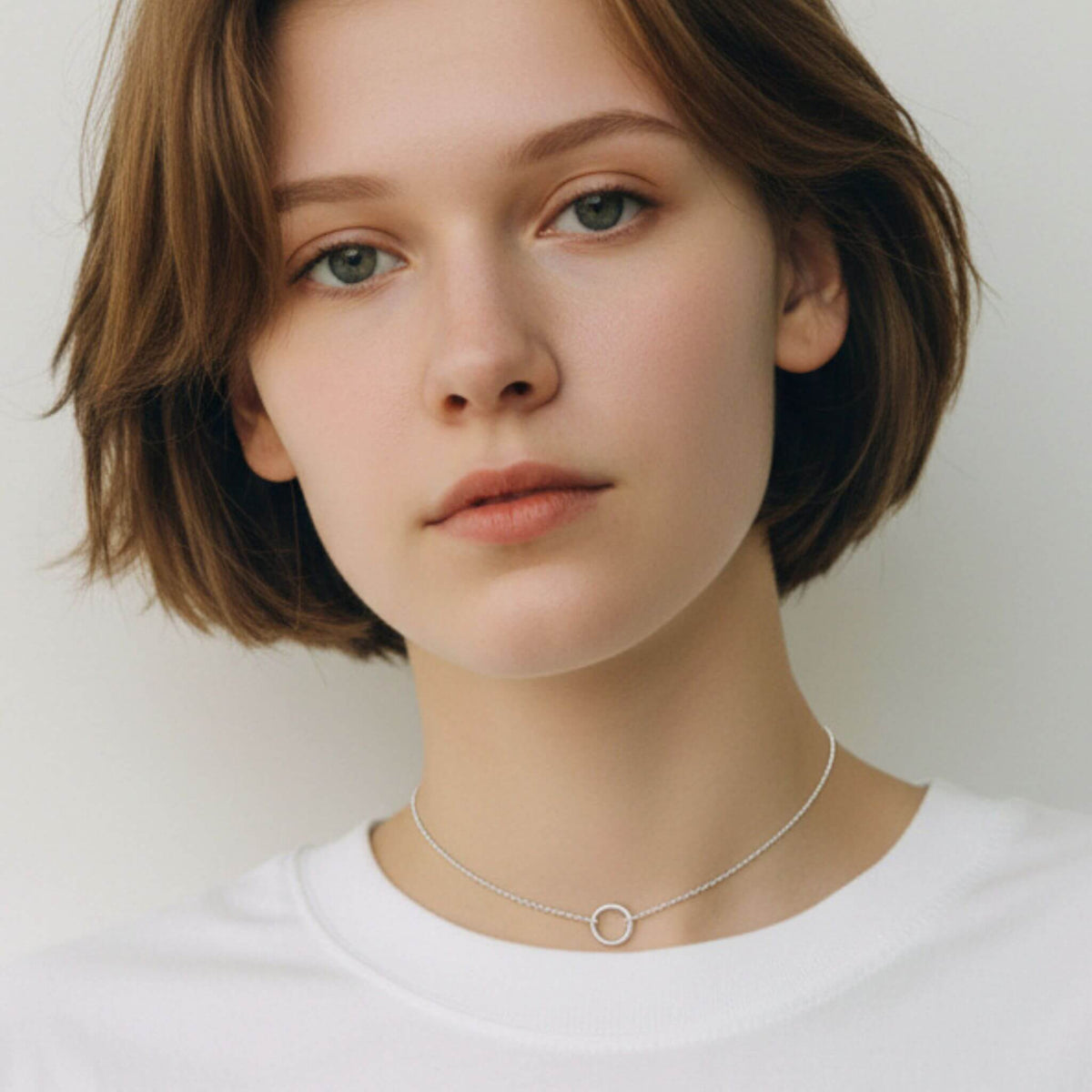 Sterling silver open circle choker necklace worn on model showing collarbone fit