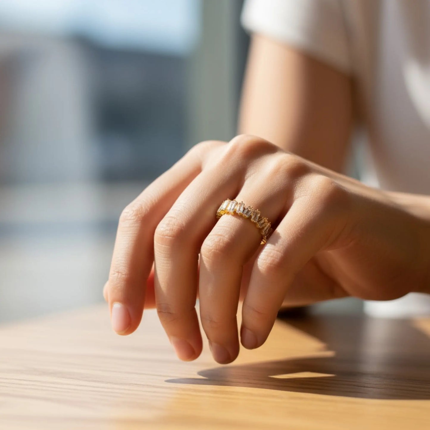 Model wearing tarnish-proof hypoallergenic cubic zirconia open ring in elegant lifestyle setting