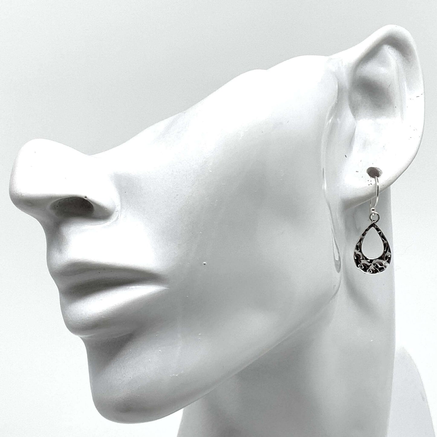 Dainty sterling silver teardrop earrings with a timeless silhouette.