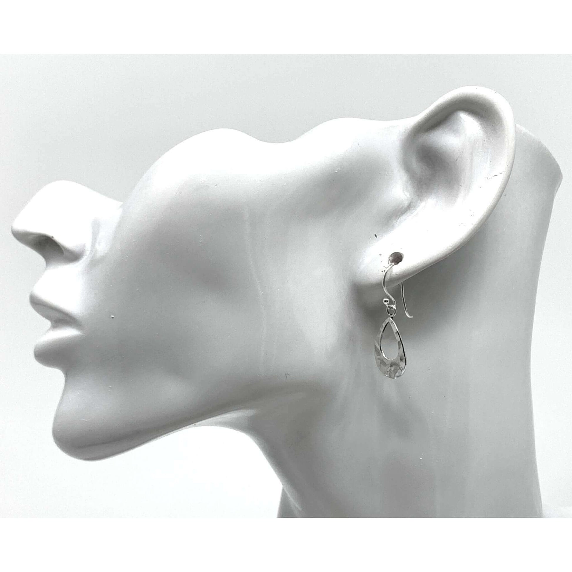 Dainty sterling silver teardrop earrings, perfect for any occasion.